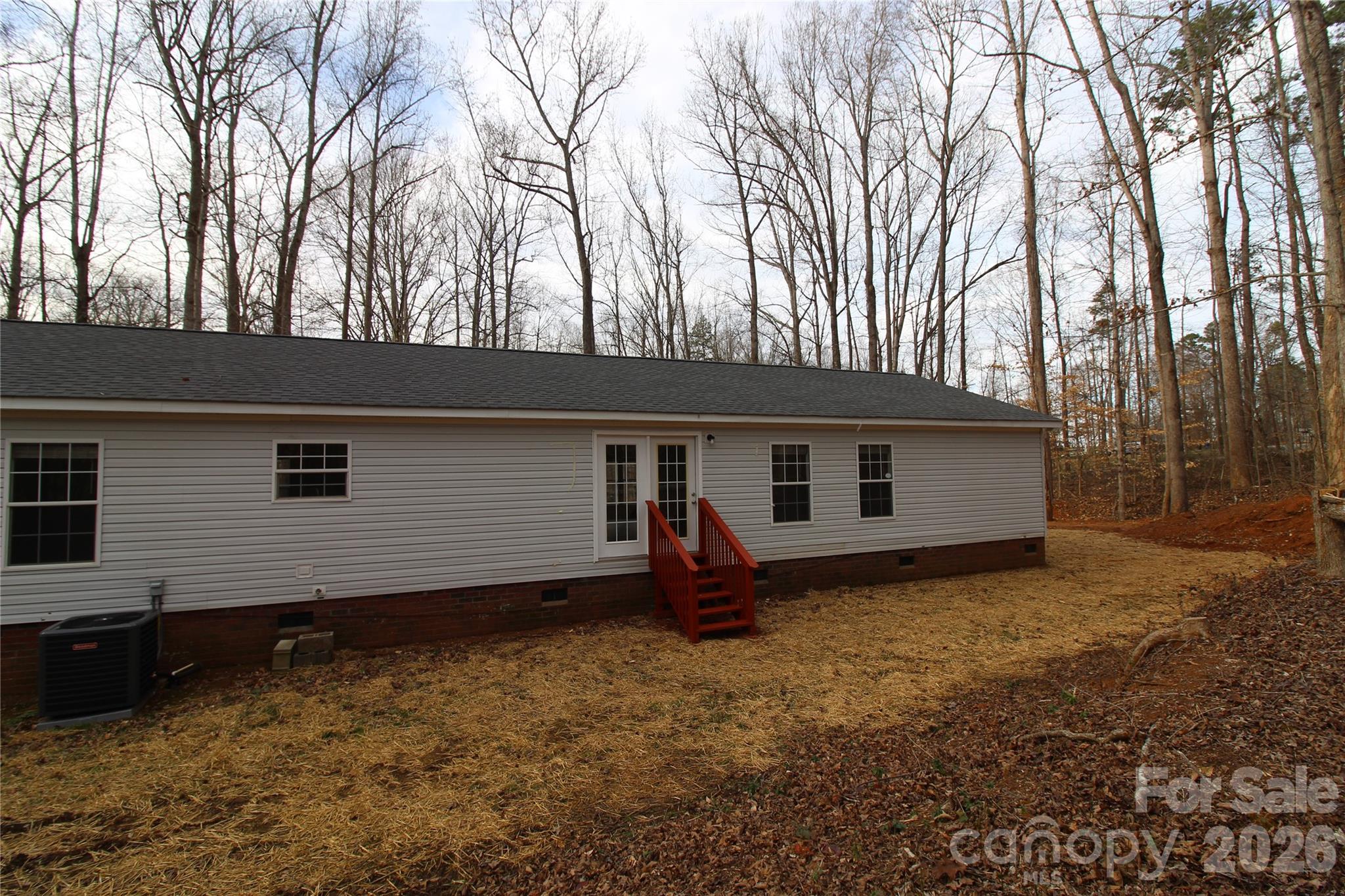 410 Johnstone Road Cleveland, NC 27013 - Photo 34 of 43 a backyard of a house with seating space
