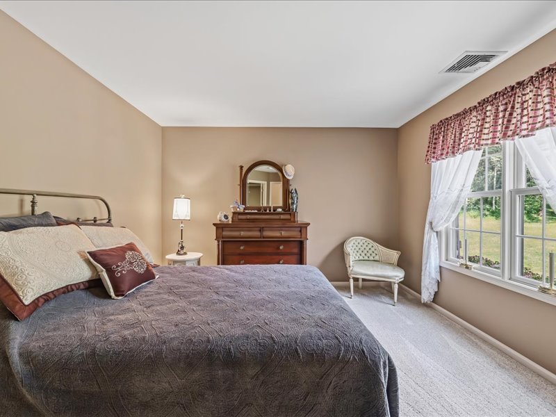 1168 Mt Pleasant Road Bangor, PA 18013 - Photo 74 of 100 A spacious bedroom features soft carpet and wide windows looking out to the yard.