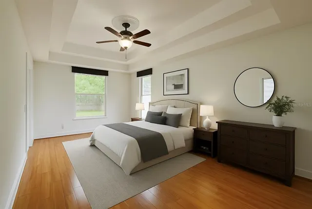 a bed room with a bed and a chandelier