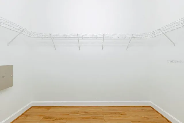 a view of a room with racks on the wall