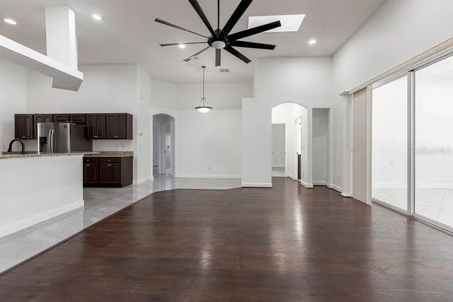 a view of a kitchen with a sink and a microwave