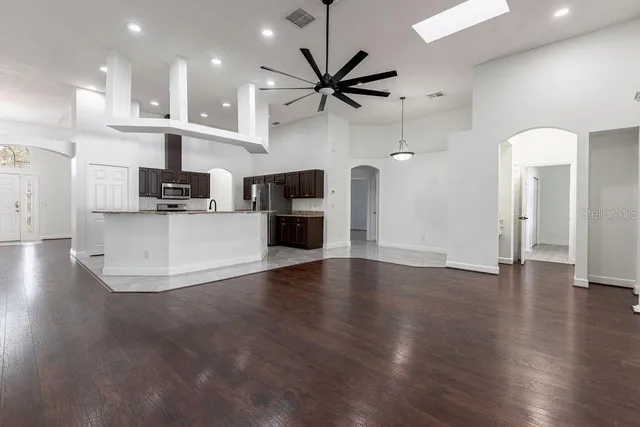 a view of a kitchen with a sink and a stove top oven