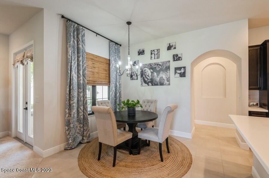 8072 Rungsted Lane Melbourne, FL 32940 - Photo 11 of 59 a dining room with furniture and window