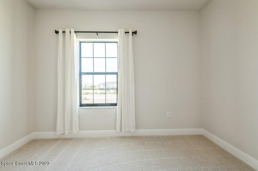 8072 Rungsted Lane Melbourne, FL 32940 - Photo 42 of 59 an empty room with window