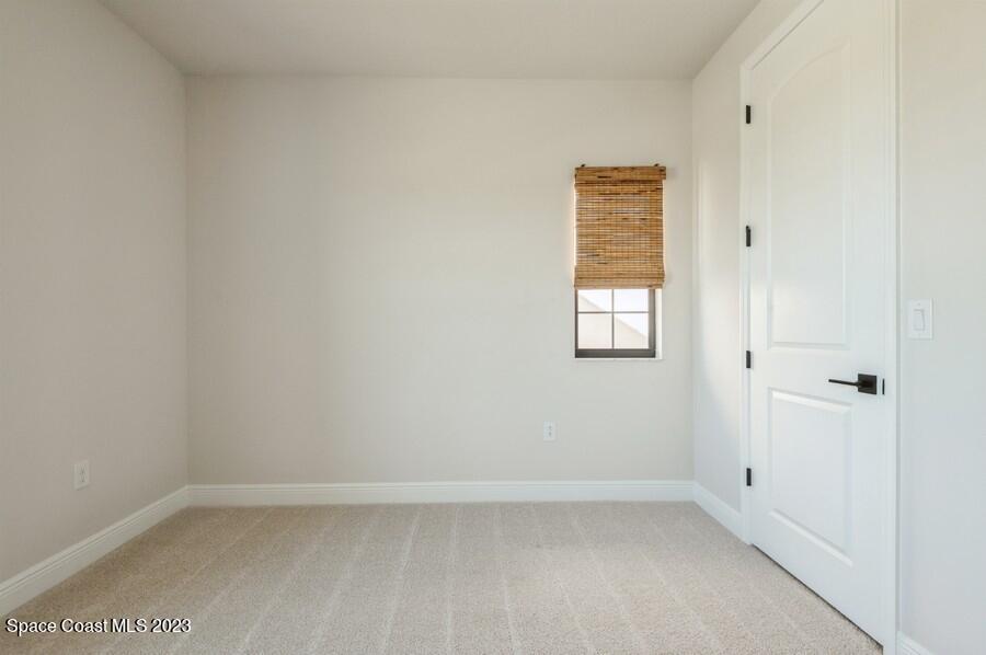 8072 Rungsted Lane Melbourne, FL 32940 - Photo 43 of 59 a view of an empty room with a window