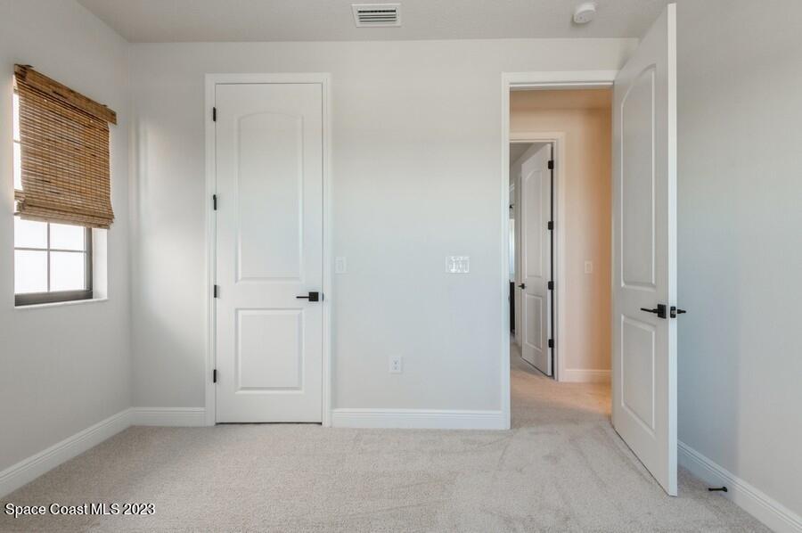 8072 Rungsted Lane Melbourne, FL 32940 - Photo 44 of 59 a view of an empty room with closet and a window