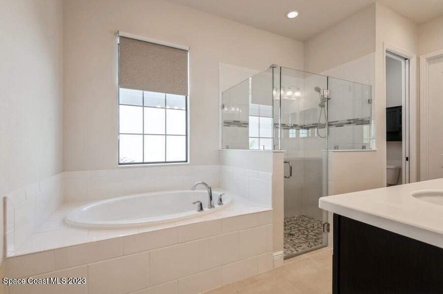8072 Rungsted Lane Melbourne, FL 32940 - Photo 56 of 59 a bathroom with a bathtub and a sink