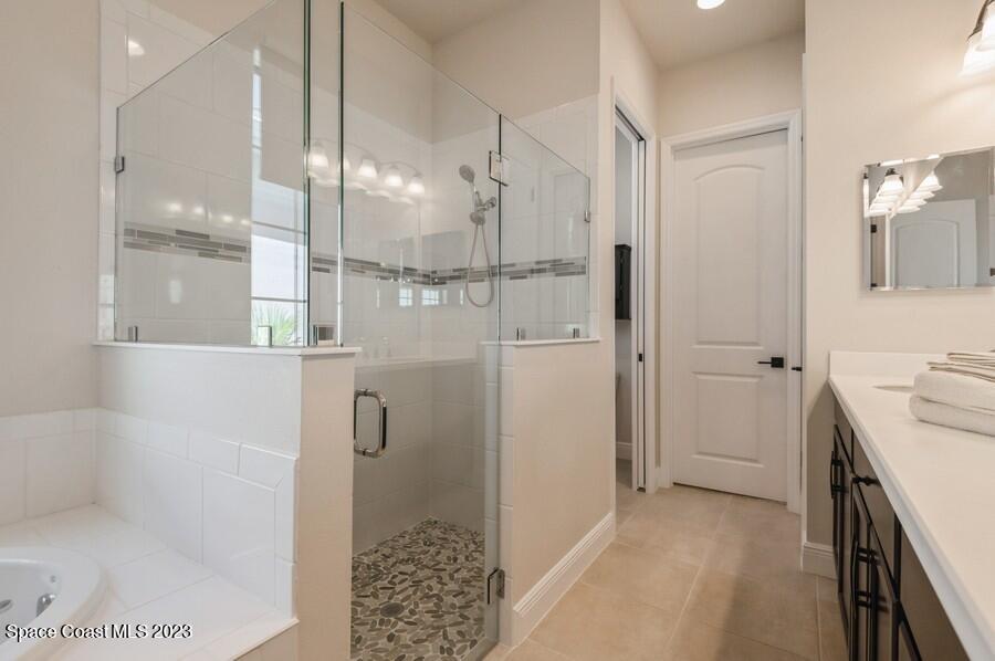8072 Rungsted Lane Melbourne, FL 32940 - Photo 57 of 59 a bathroom with a shower and a sink