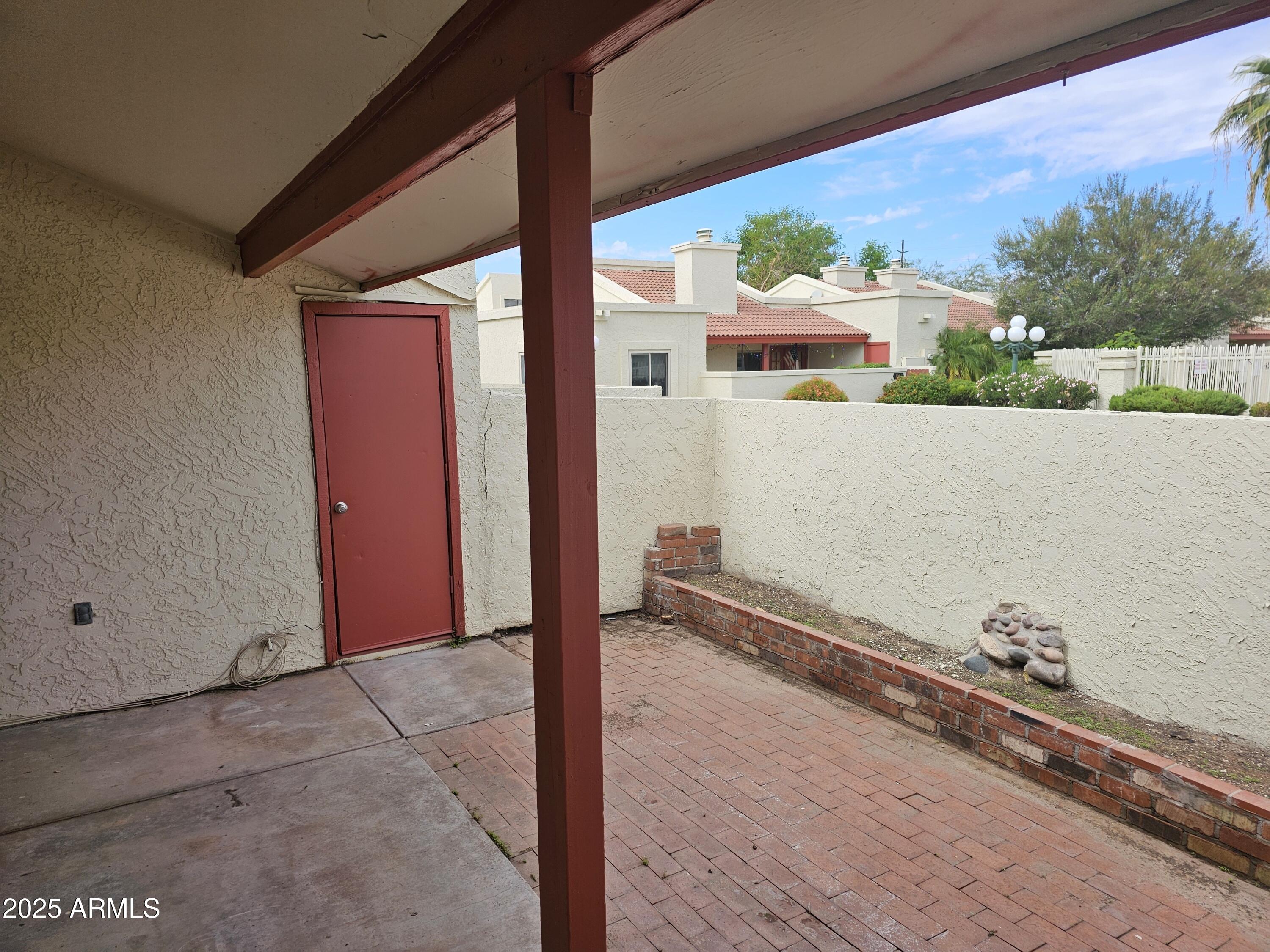 633 West Southern Avenue, Unit 1118 Tempe, AZ 85282 - Photo 11 of 12 a front view of a house with a yard