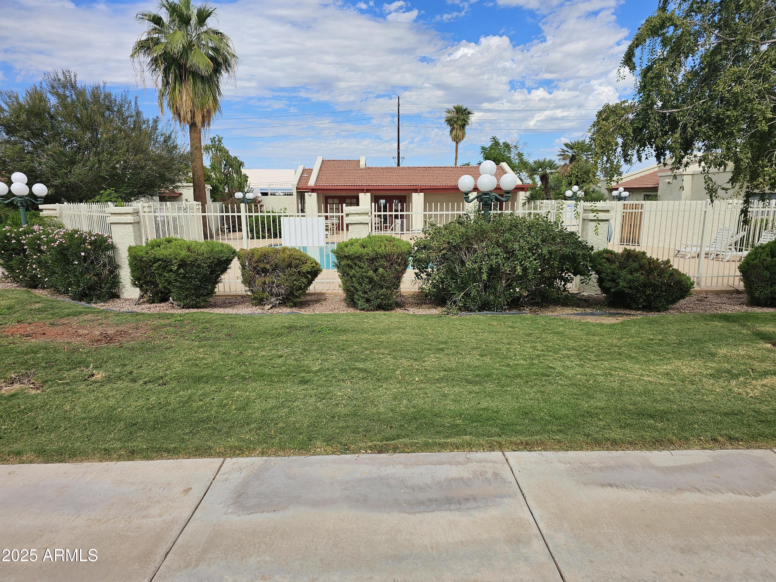 633 West Southern Avenue, Unit 1118 Tempe, AZ 85282 - Photo 2 of 12 a front view of a house with a yard