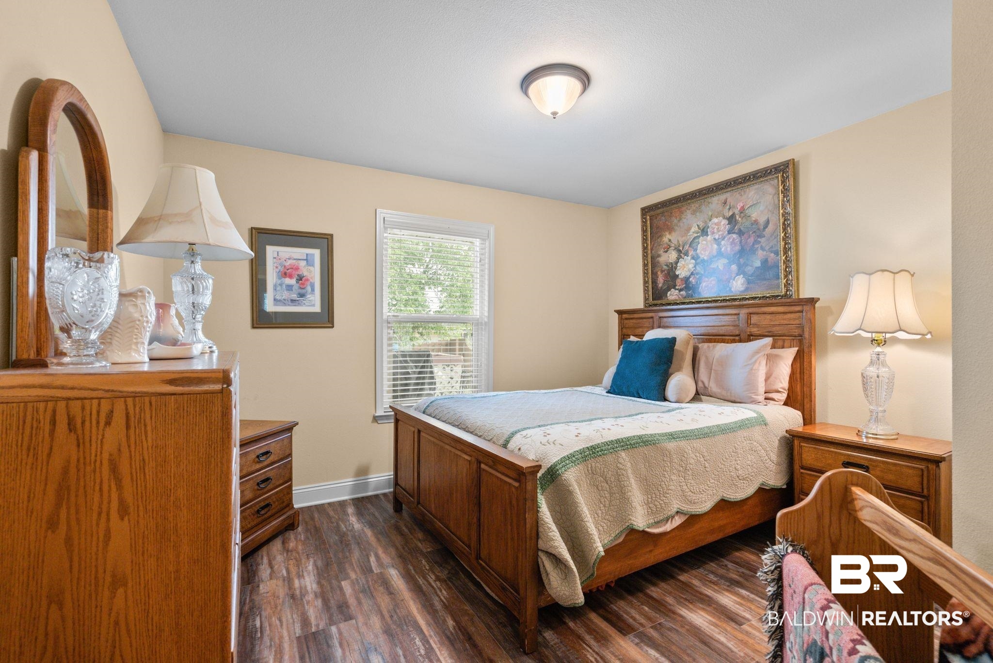 562 Vestige Mews Foley, AL 36535 - Photo 29 of 54 Spacious room featuring wood-finish flooring, a window with blinds, and neutral wall tones