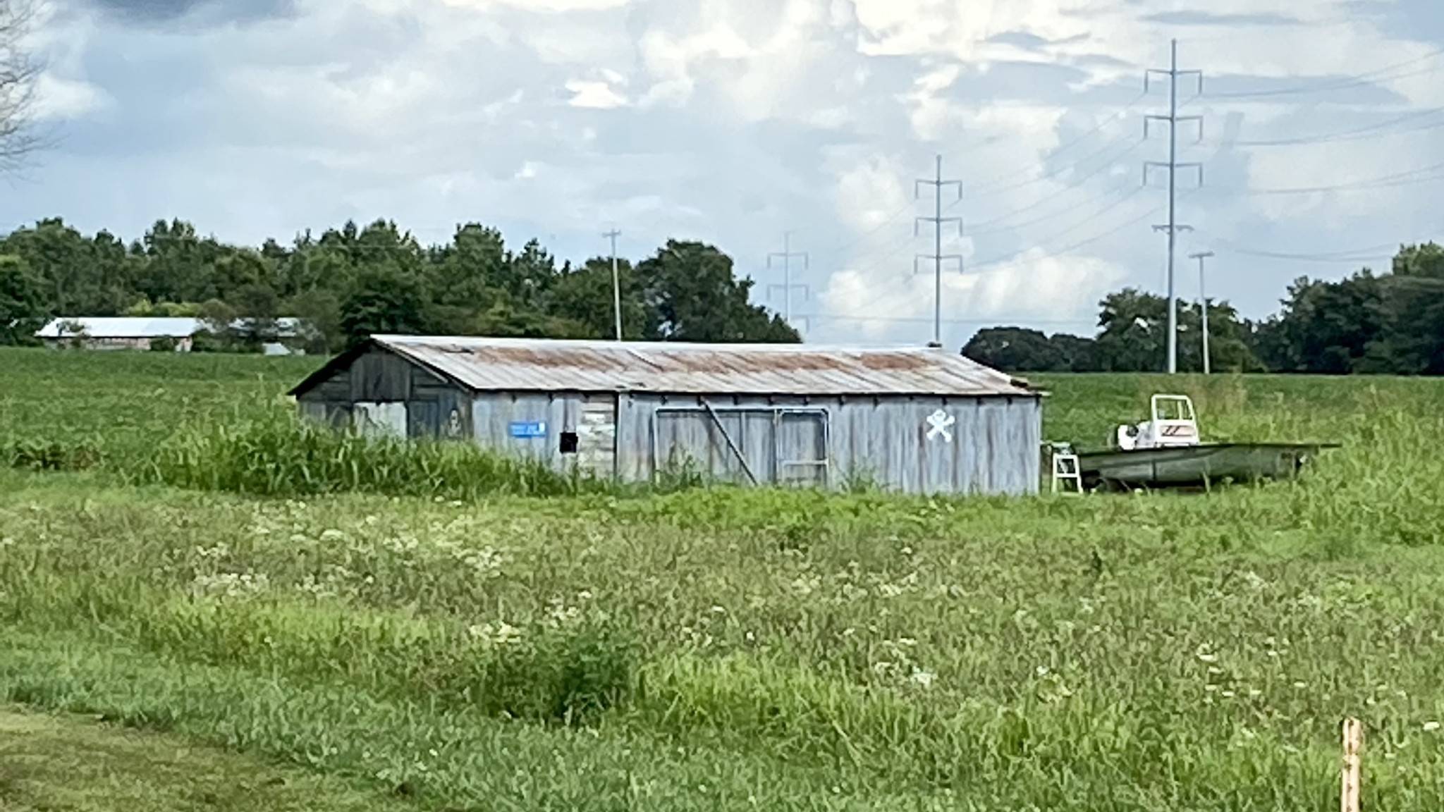 129 Dunn Fall River Road Leoma, TN 38468 - Photo 32 of 36 a view of a barn in the middle of a yard