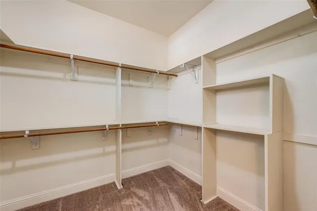 a view of an empty walk in closet