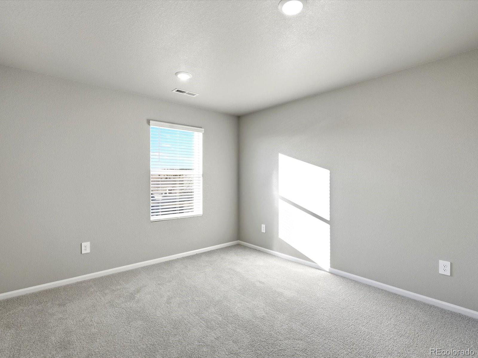 7317 West 27th St Road Greeley, CO 80634 - Photo 19 of 28 an empty room with a window