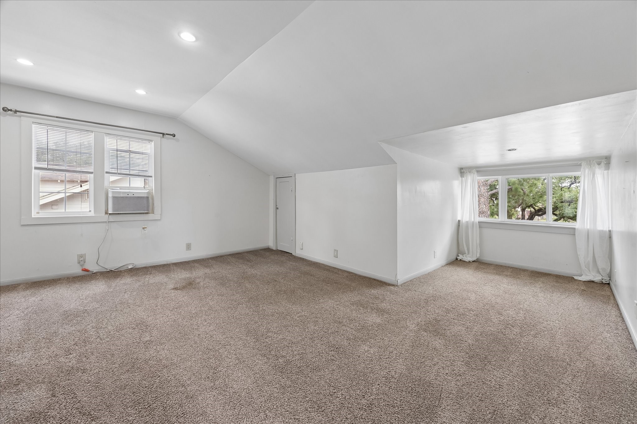 4412 Rusk Street Houston, TX 77023 - Photo 24 of 44 Exterior stairs lead to a separate second story living space with kitchen & full bath. Perfect space for mother-in-law suite, home office or reliable rental income. Living room boasts vaulted ceilings, recent carpet & recently replaced A/C unit.
