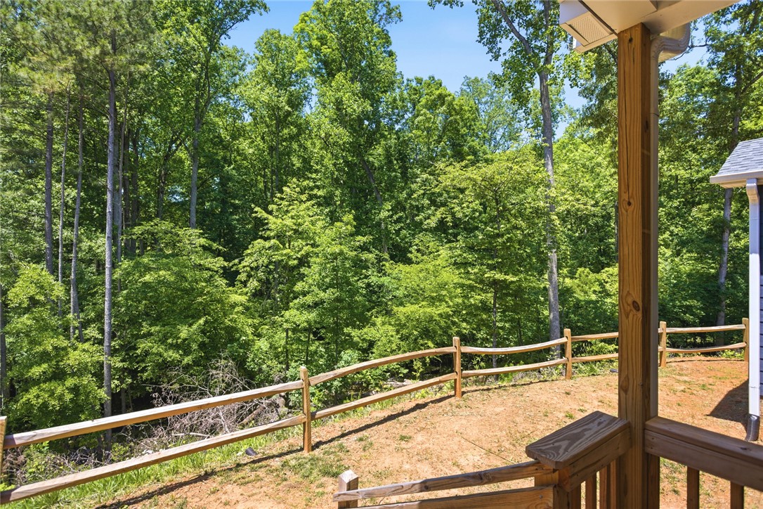 912 Watercrest Road West Union, SC 29696 - Photo 35 of 49 This verdant outdoor space features natural fencing and an inviting view of mature trees.