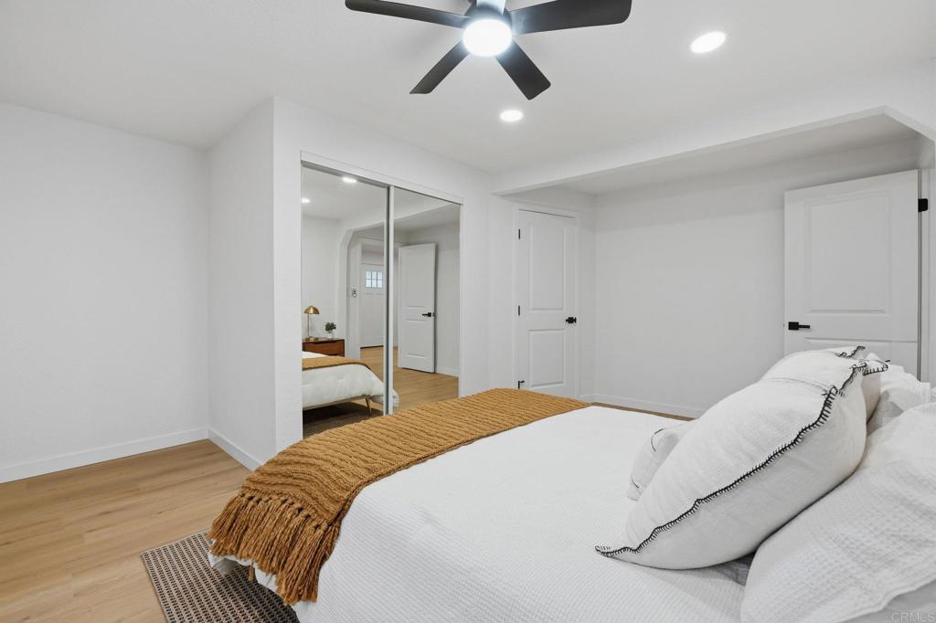 1333 Helix Street Spring Valley, CA 91977 - Photo 28 of 45 a bedroom with a bed and a ceiling fan