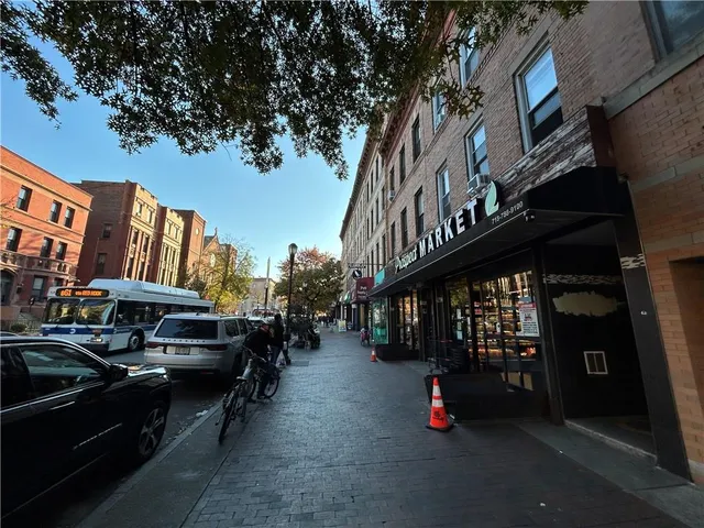 a view of street with parked cars