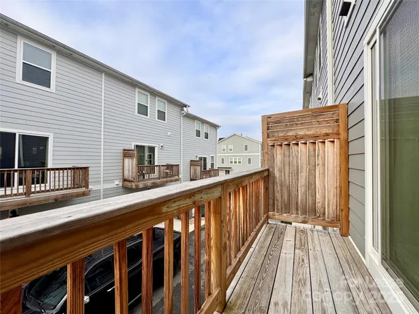a view of a house with wooden deck