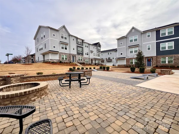 a building outdoor space with patio outdoor seating and trees