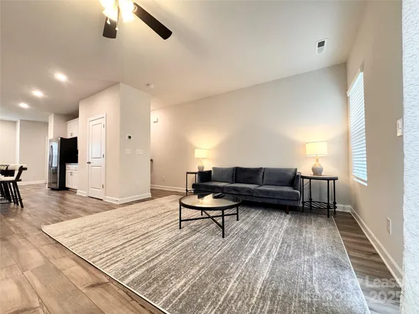 a living room with furniture and a table