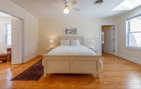a bedroom with a bed and window