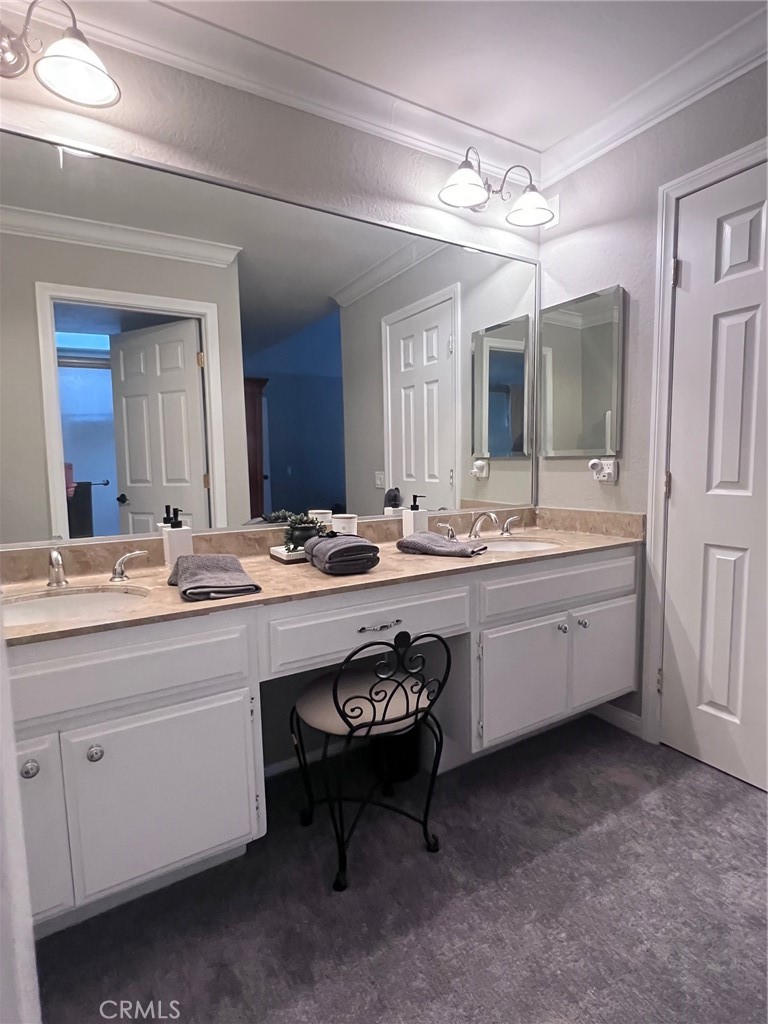 16083 Crete Lane Huntington Beach, CA 92649 - Photo 14 of 22 a bathroom with a sink and a mirror