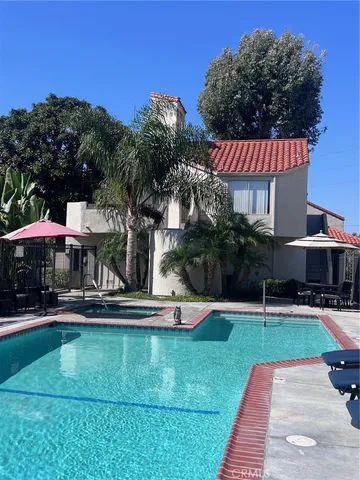 a swimming pool with outdoor seating and yard