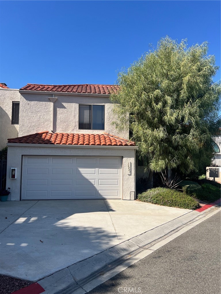 16083 Crete Lane Huntington Beach, CA 92649 - Photo 21 of 22 a front view of a house with a yard