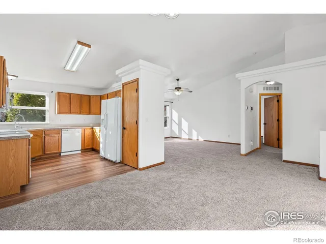 a view of a livingroom with a kitchen