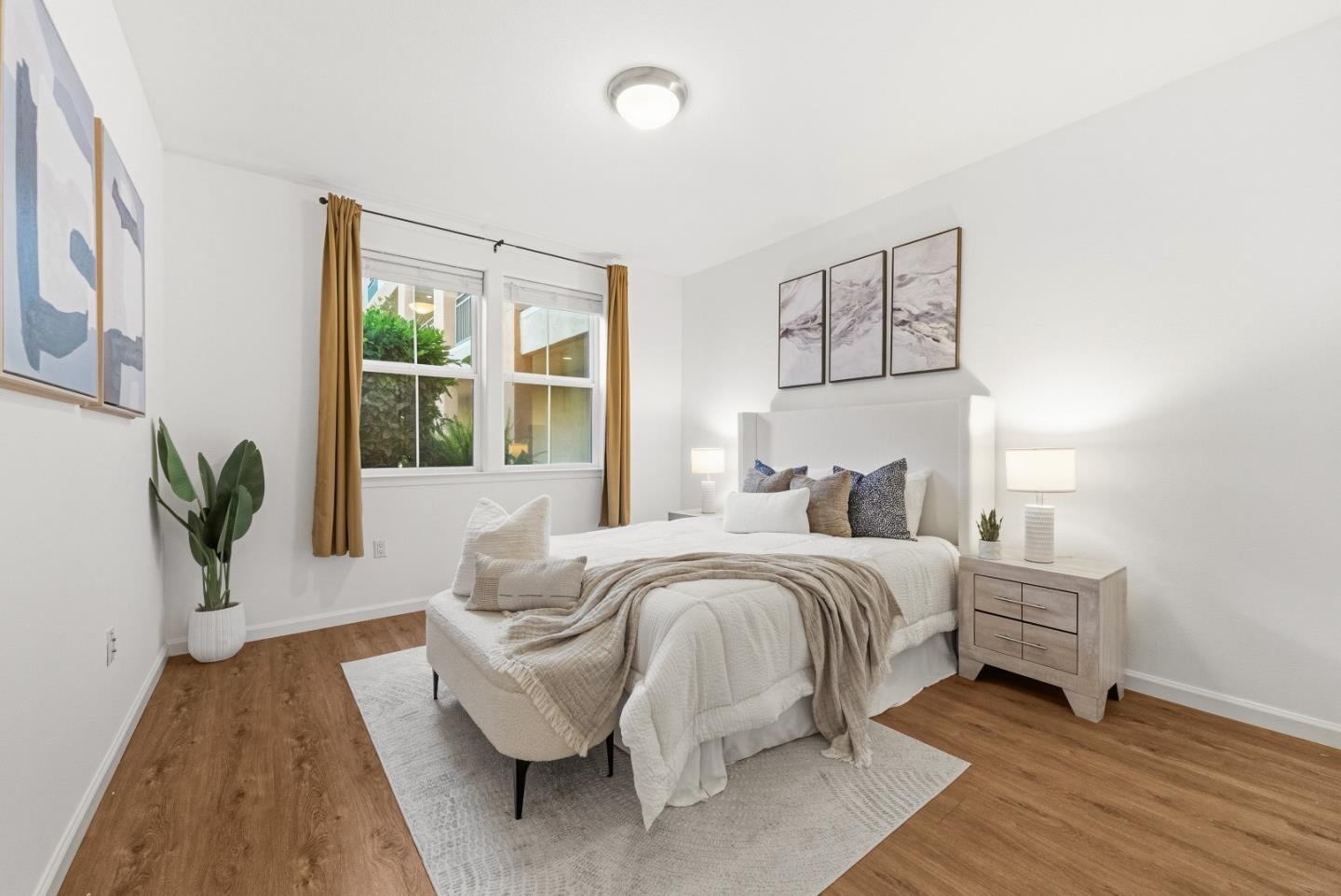 1390 Saddle Rack Street, Unit 223 San Jose, CA 95126 - Photo 18 of 36 a spacious bedroom with a bed and wooden floor