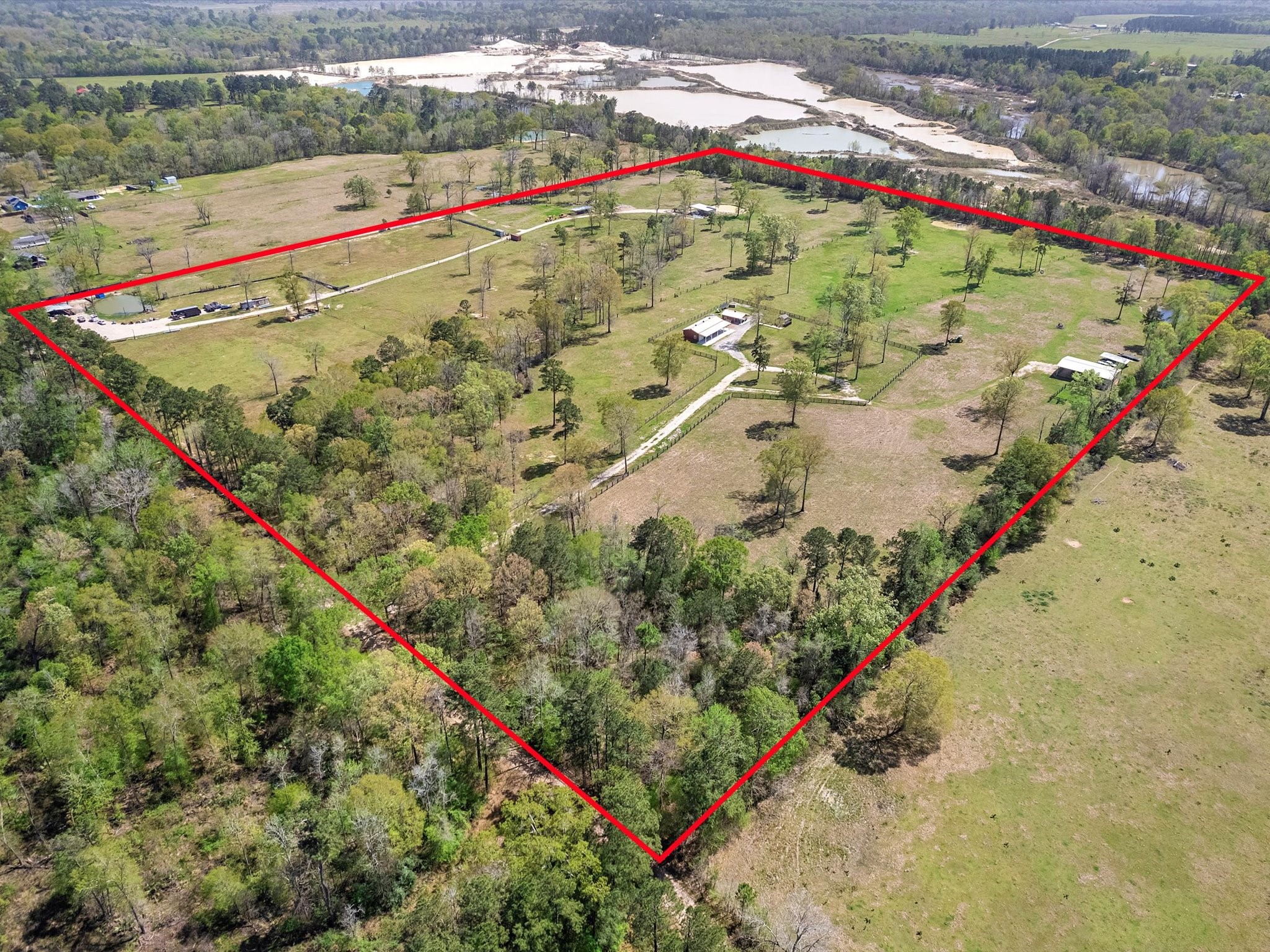 1164 County Road 332 Cleveland, TX 77327 - Photo 1 of 24 a view of a tennis court