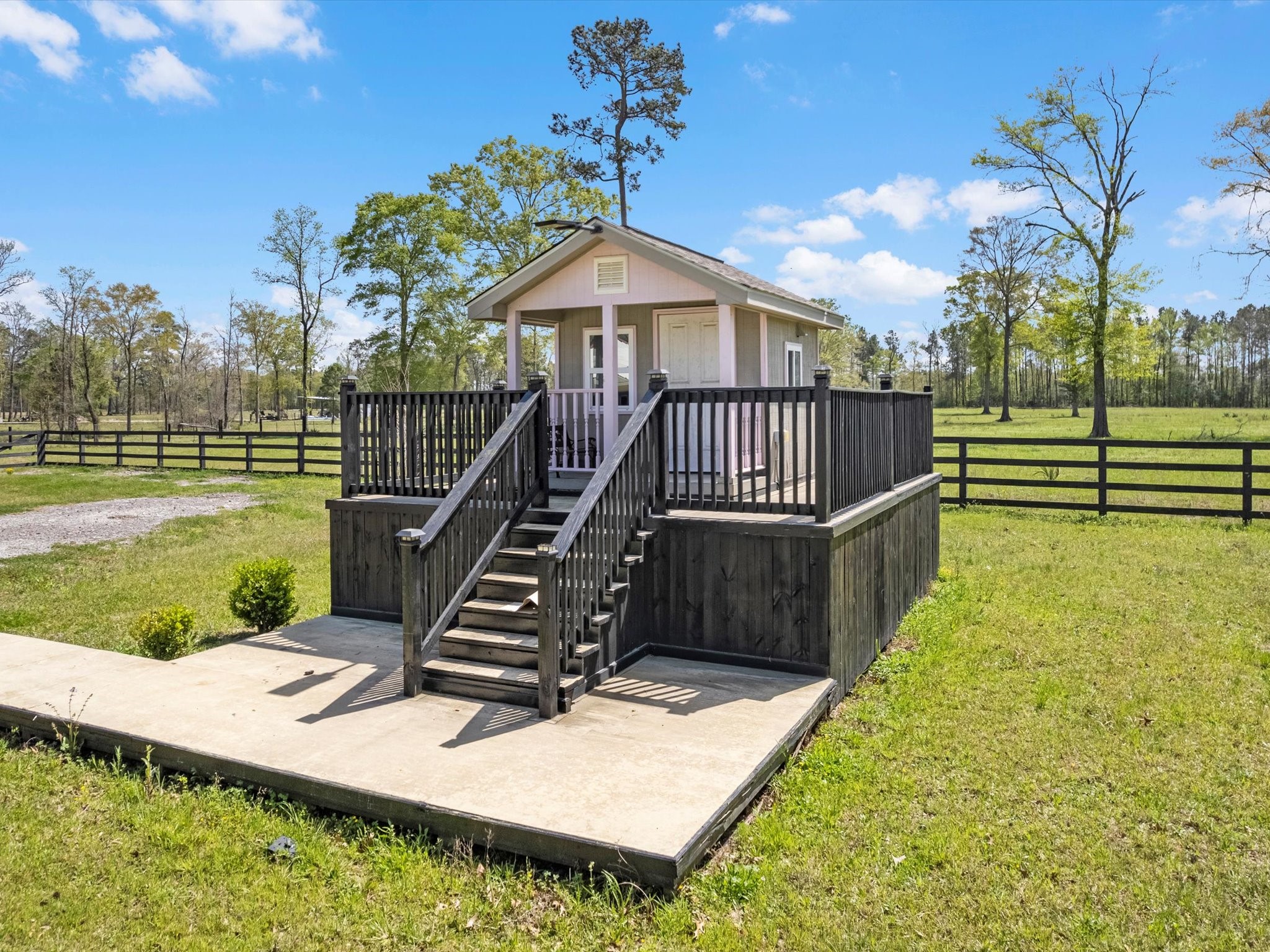 1164 County Road 332 Cleveland, TX 77327 - Photo 12 of 24 a view of a house with a yard