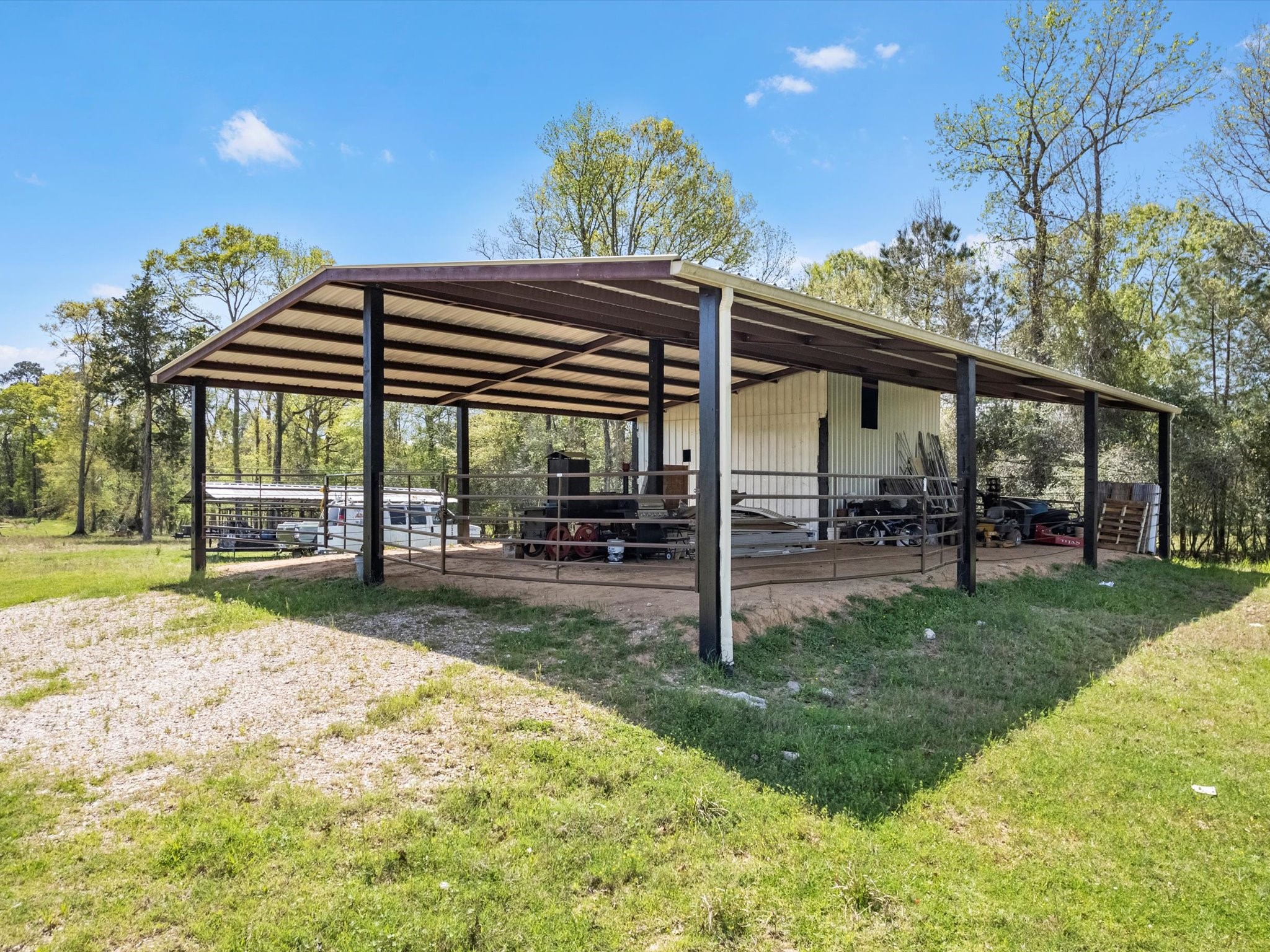 1164 County Road 332 Cleveland, TX 77327 - Photo 19 of 24 a view of a house with backyard and porch