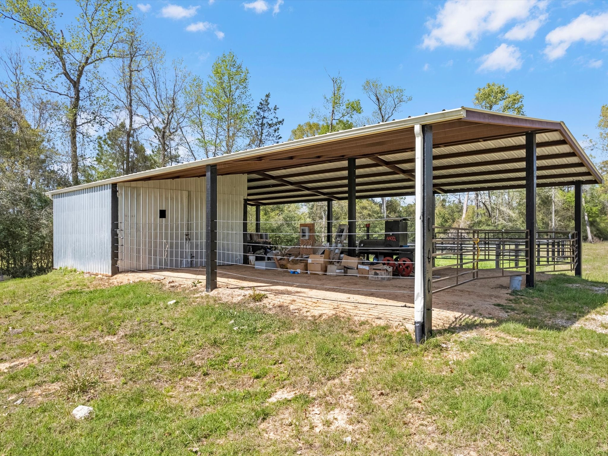 1164 County Road 332 Cleveland, TX 77327 - Photo 20 of 24 a backyard of a house with table and chairs