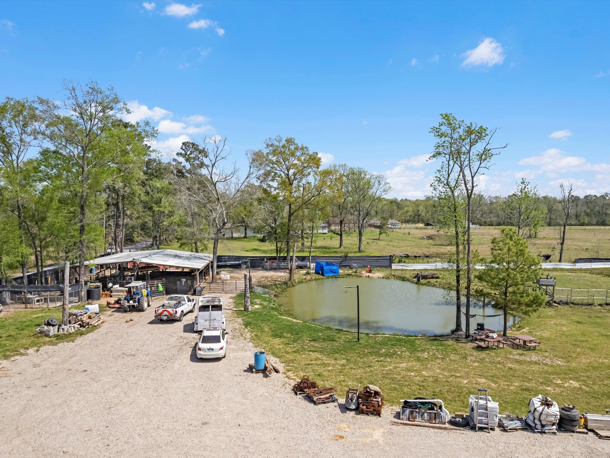 1164 County Road 332 Cleveland, TX 77327 - Photo 23 of 24 a view of a lake with a car parked