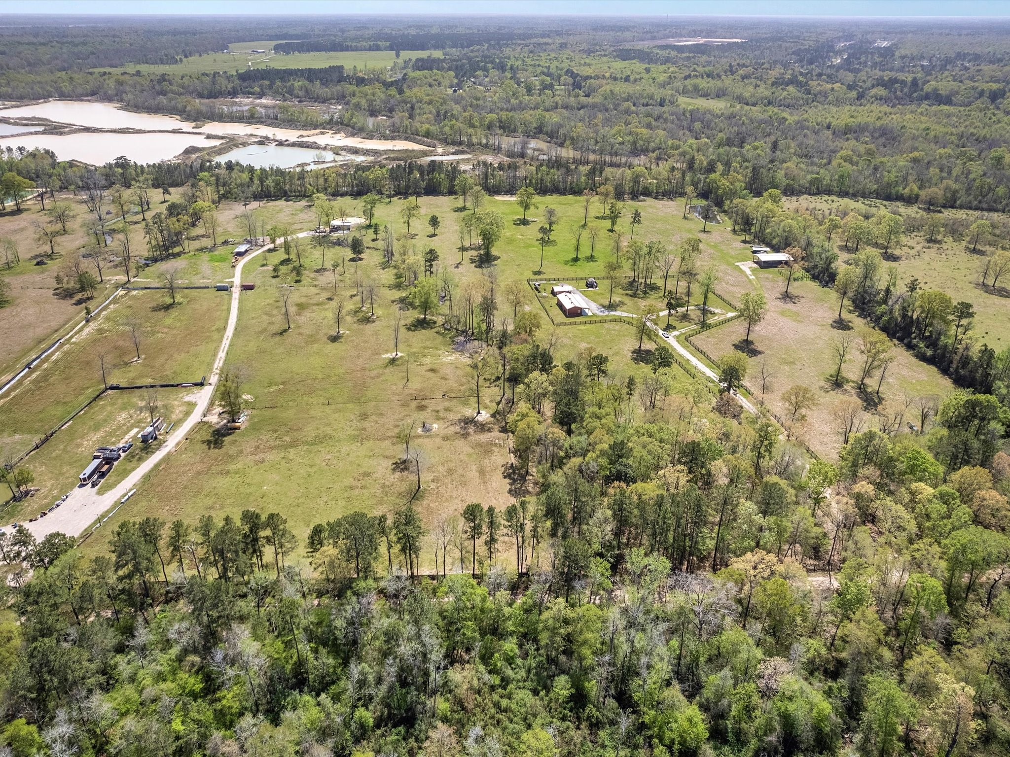 1164 County Road 332 Cleveland, TX 77327 - Photo 5 of 24 an aerial view of residential houses with outdoor space