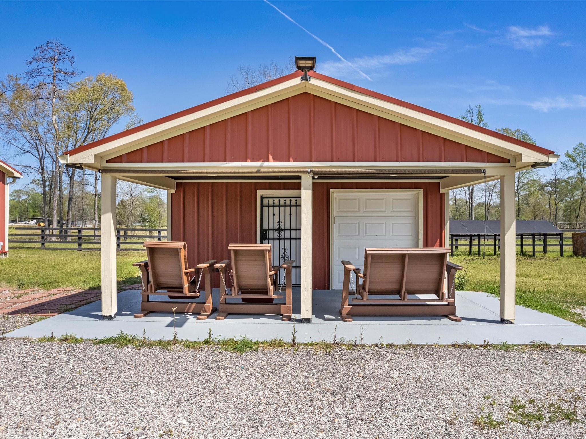 1164 County Road 332 Cleveland, TX 77327 - Photo 10 of 24 a front view of a house with patio furniture and garden