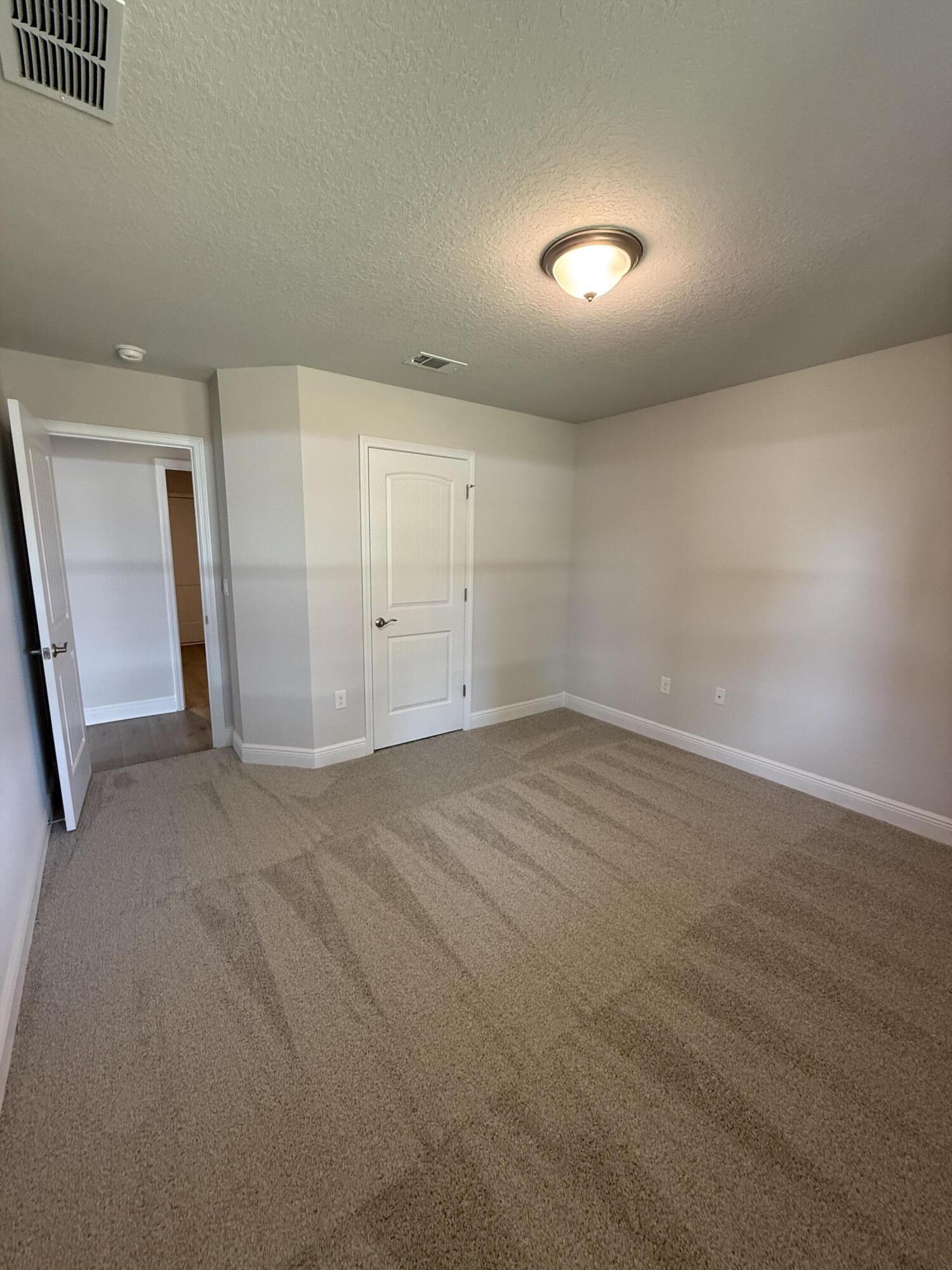 194 Ridgeway Circle Crestview, FL 32536 - Photo 11 of 25 an empty room with a natural light