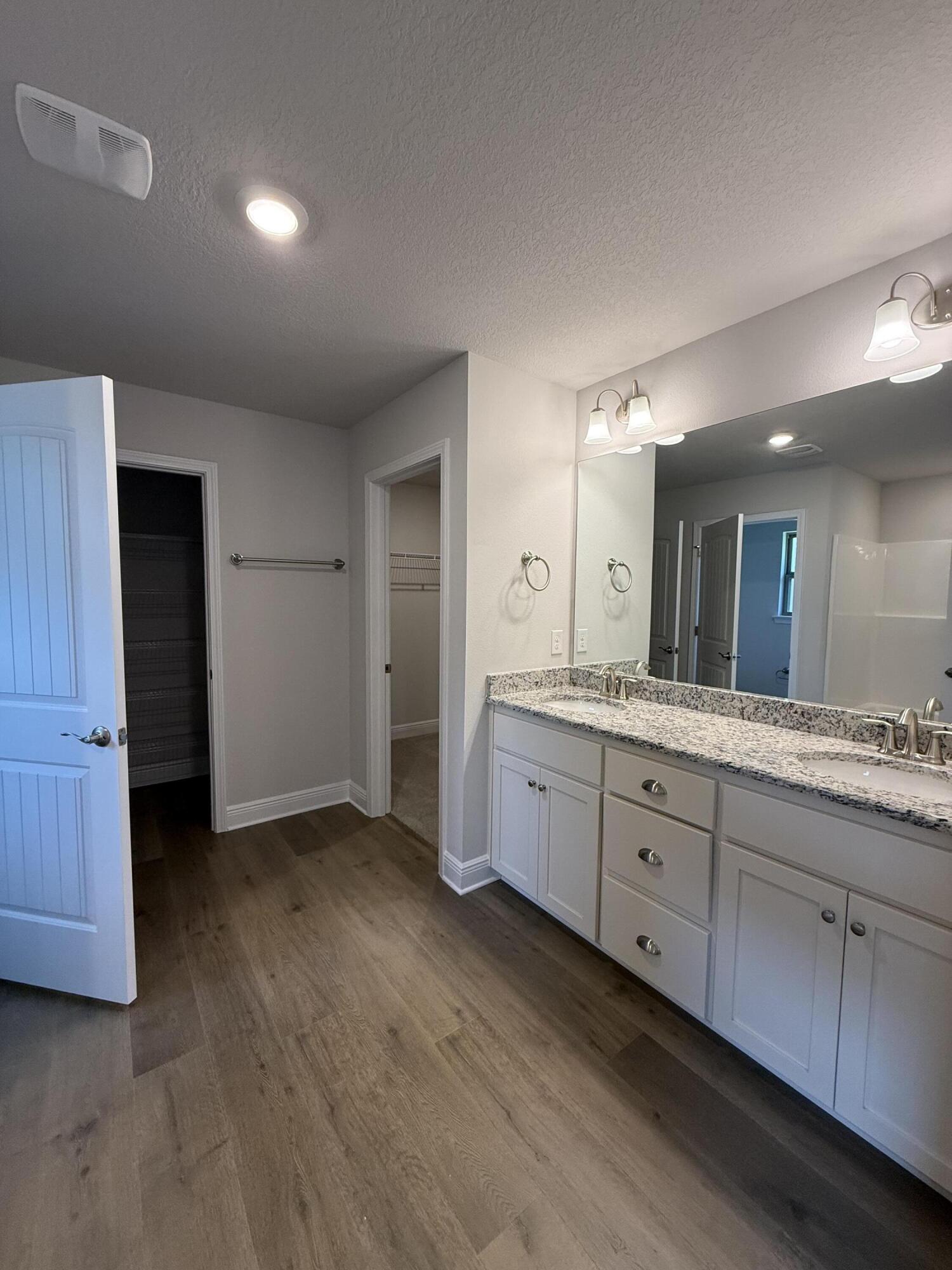 194 Ridgeway Circle Crestview, FL 32536 - Photo 13 of 25 a spacious bathroom with a granite countertop sink mirror and toilet