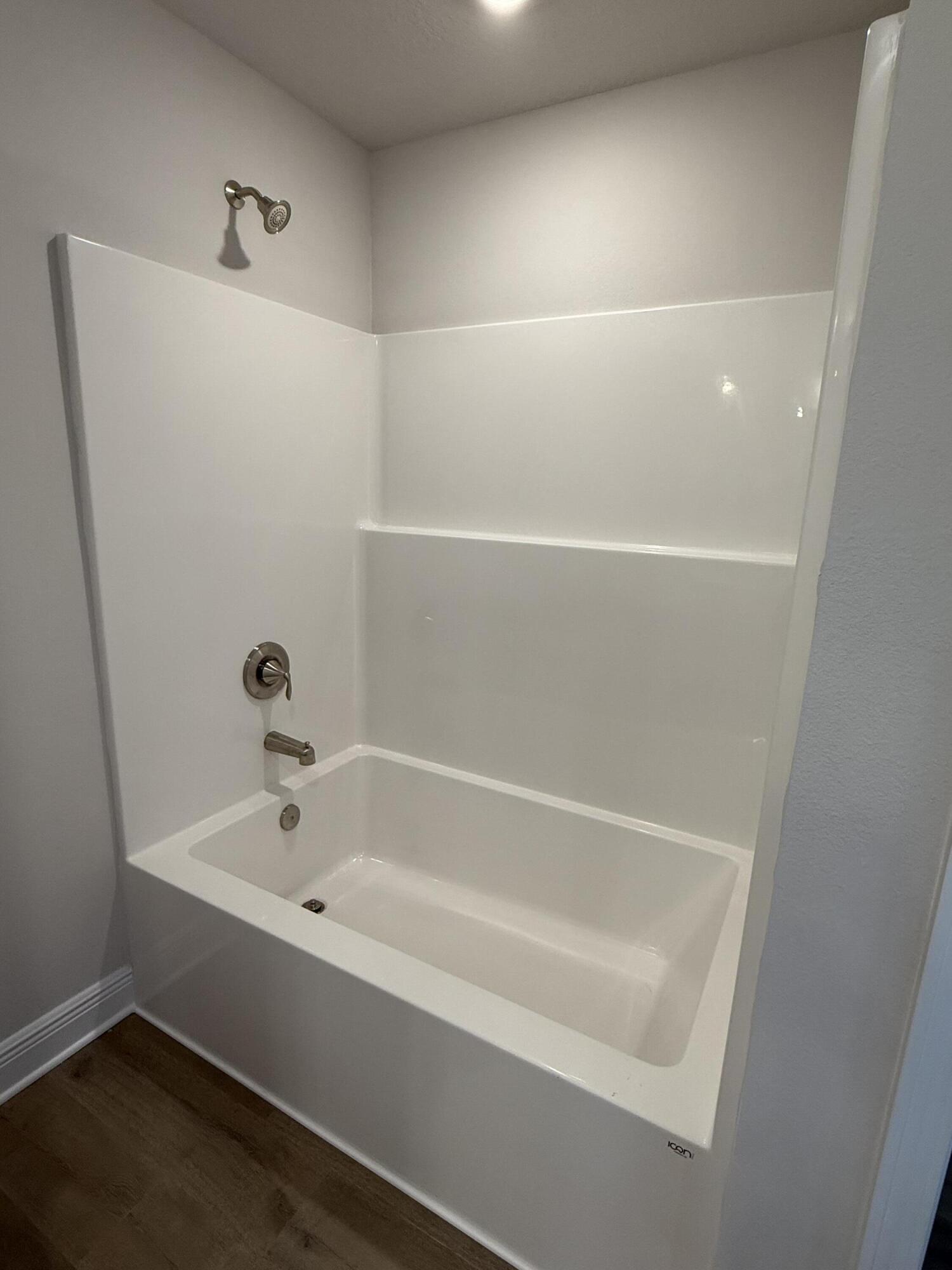 194 Ridgeway Circle Crestview, FL 32536 - Photo 14 of 25 a white bath tub sitting in a bathroom