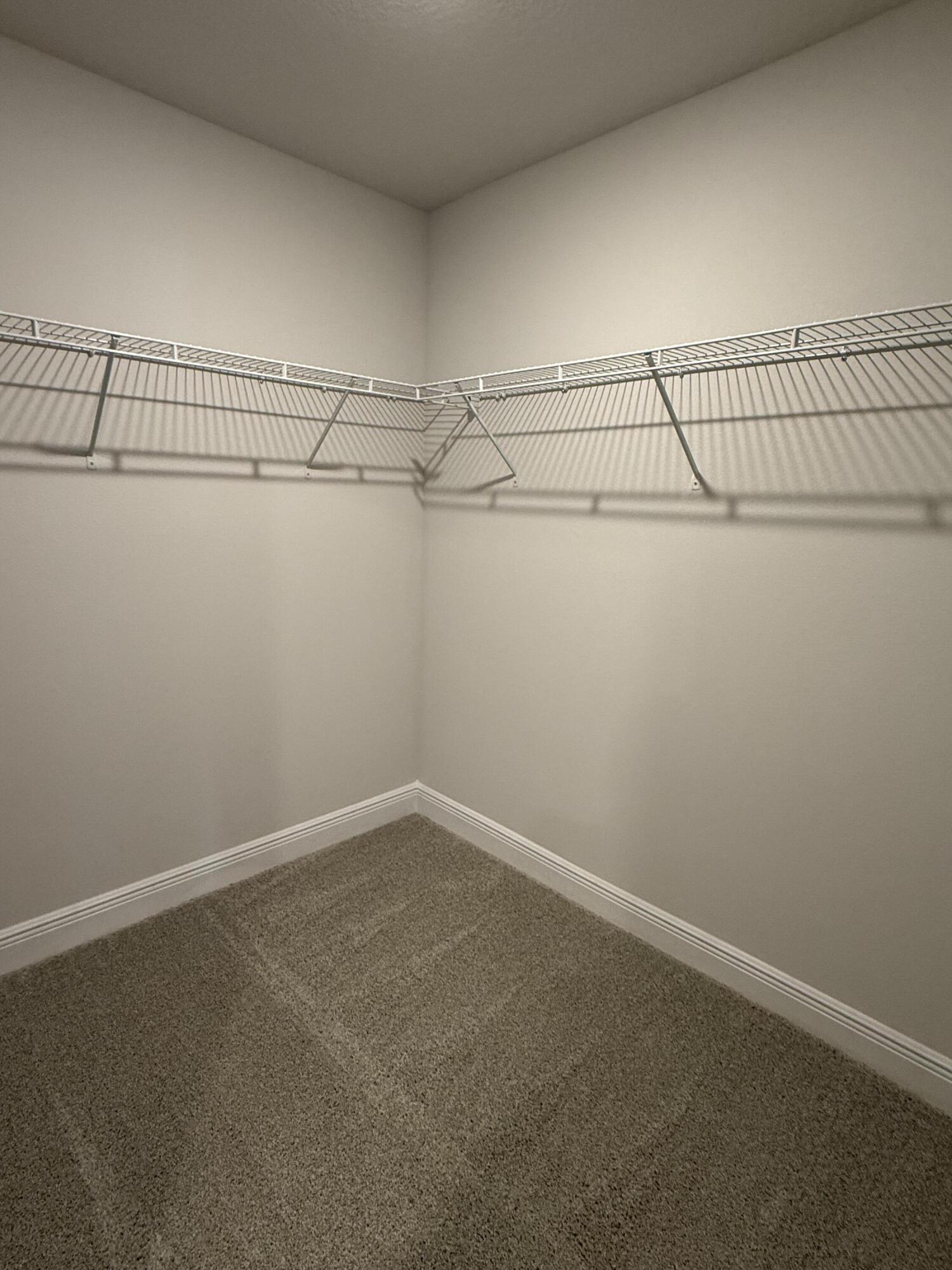 194 Ridgeway Circle Crestview, FL 32536 - Photo 16 of 25 a view of a room with racks on the wall