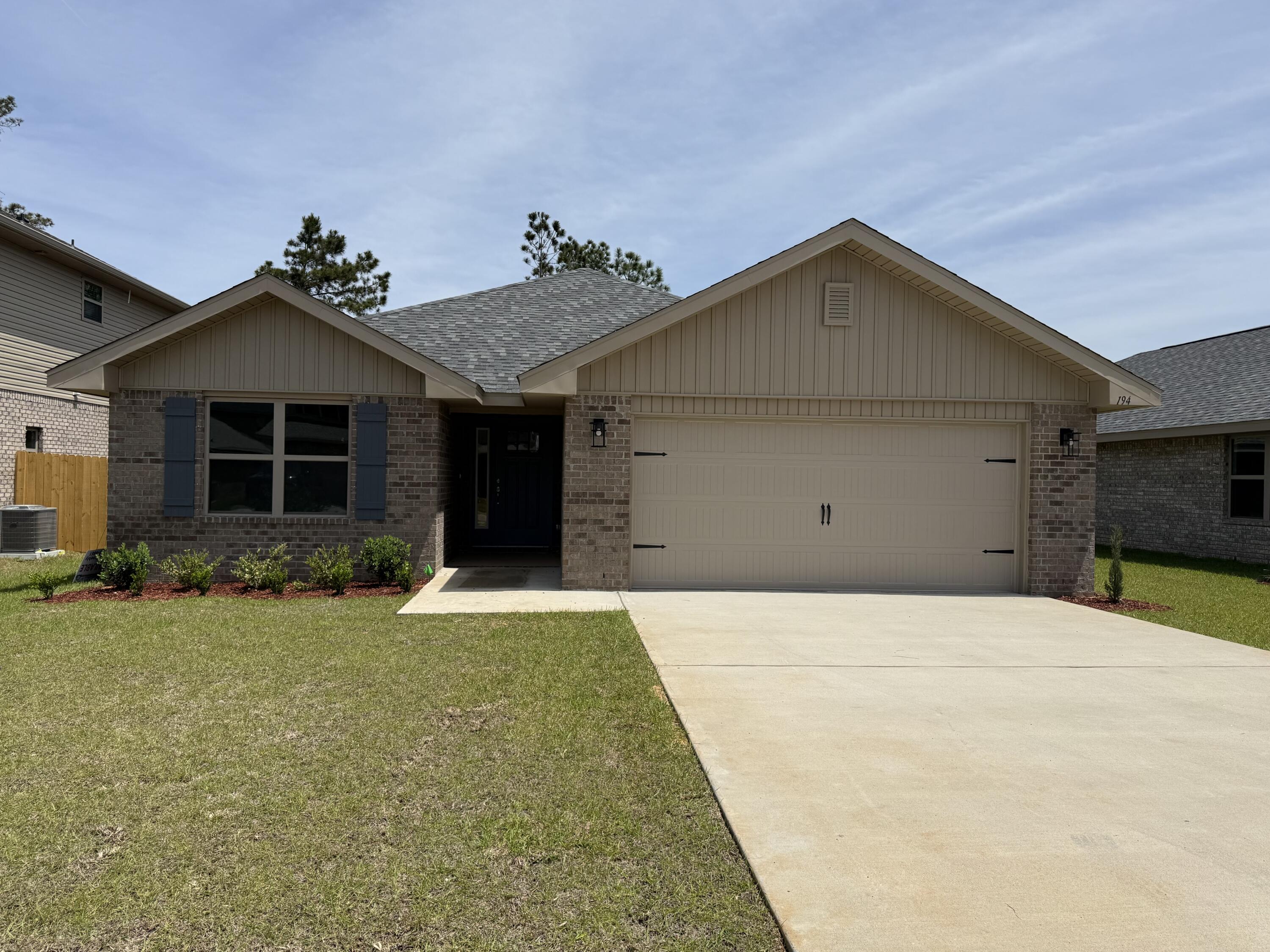 194 Ridgeway Circle Crestview, FL 32536 - Photo 2 of 25 a front view of a house with a yard