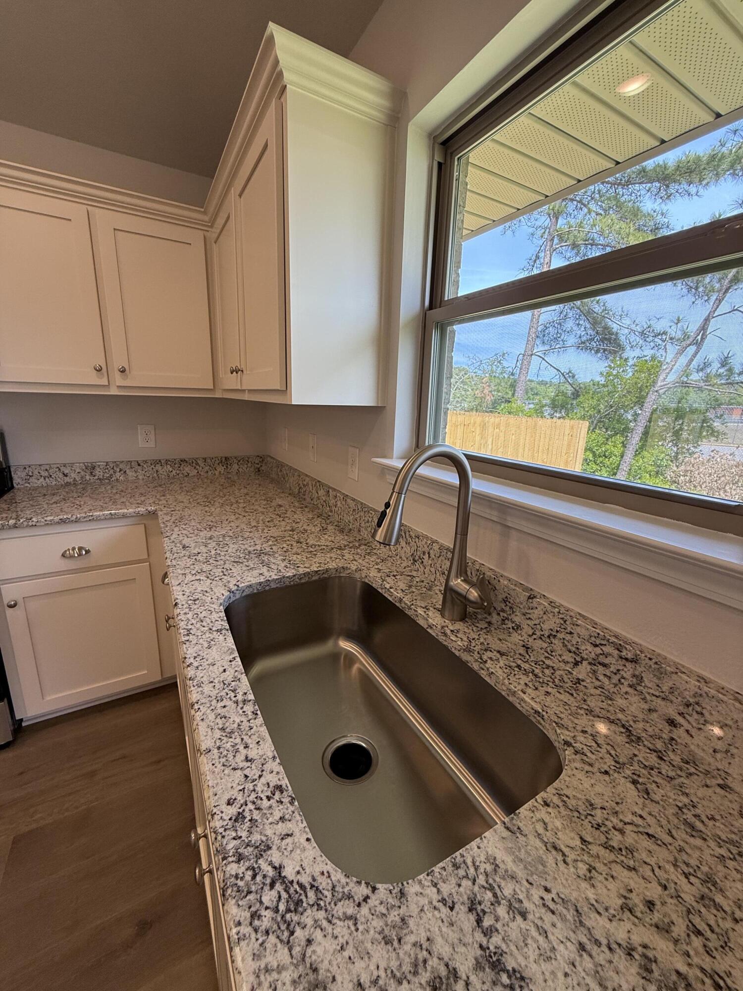 194 Ridgeway Circle Crestview, FL 32536 - Photo 21 of 25 a kitchen with a sink and a window