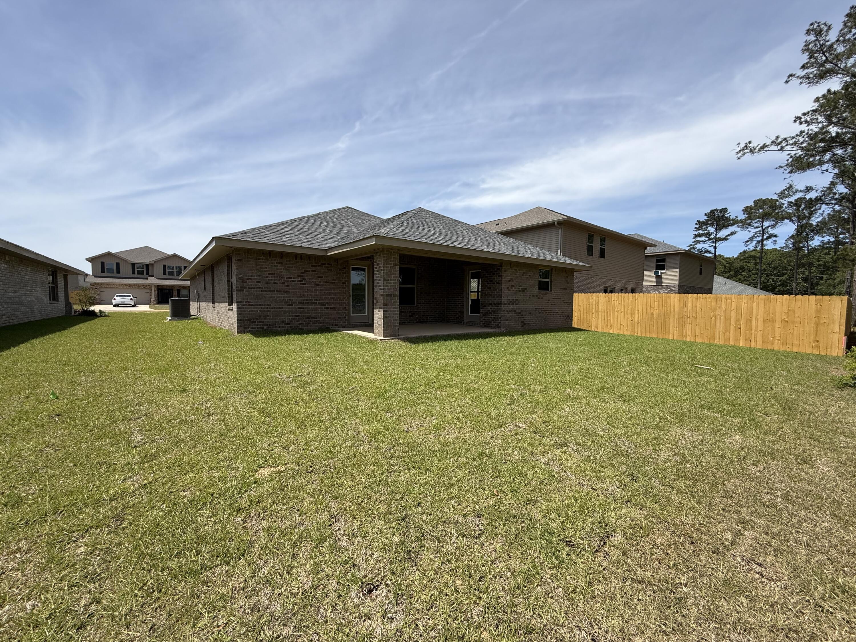 194 Ridgeway Circle Crestview, FL 32536 - Photo 23 of 25 a view of a house with a yard