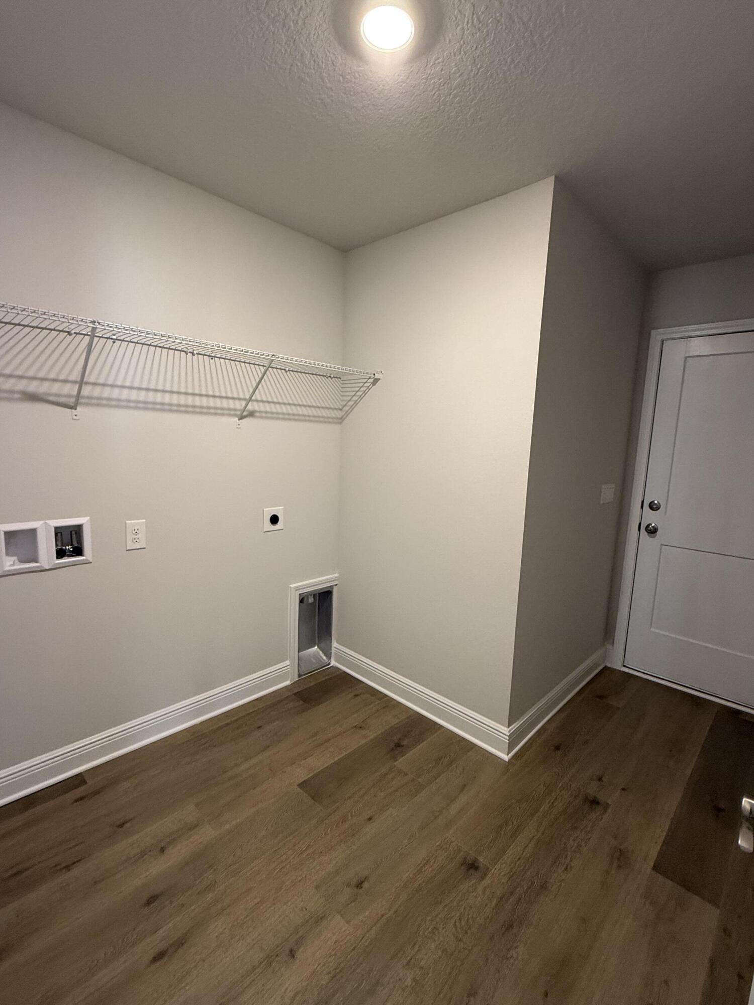 194 Ridgeway Circle Crestview, FL 32536 - Photo 10 of 25 an empty room with wooden floor and windows