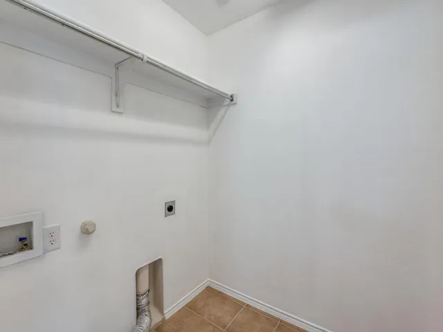 a view of small space with empty racks on the wall