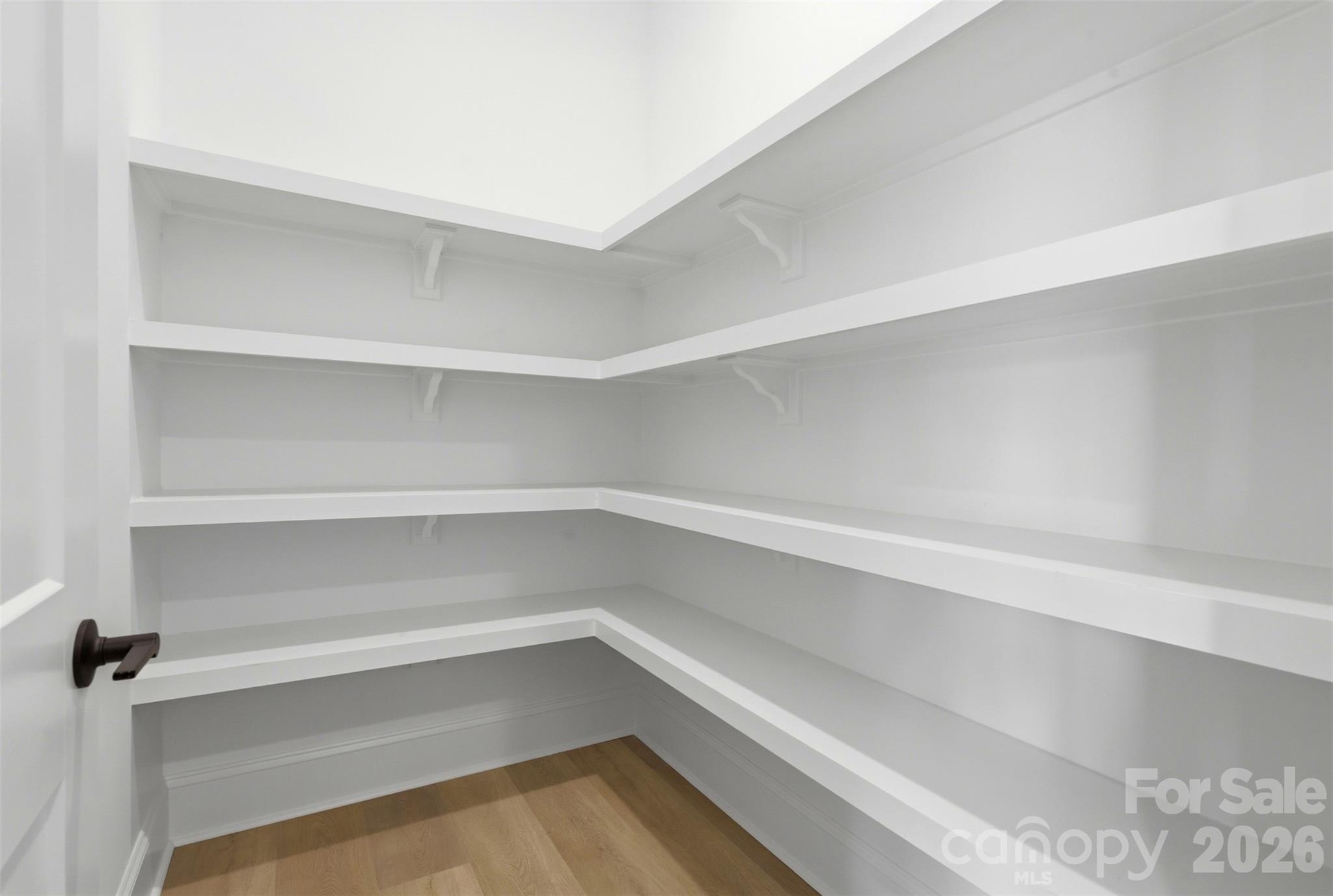 4734 Polk Ford Road Stanfield, NC 28163 - Photo 17 of 48 a storage room with empty racks