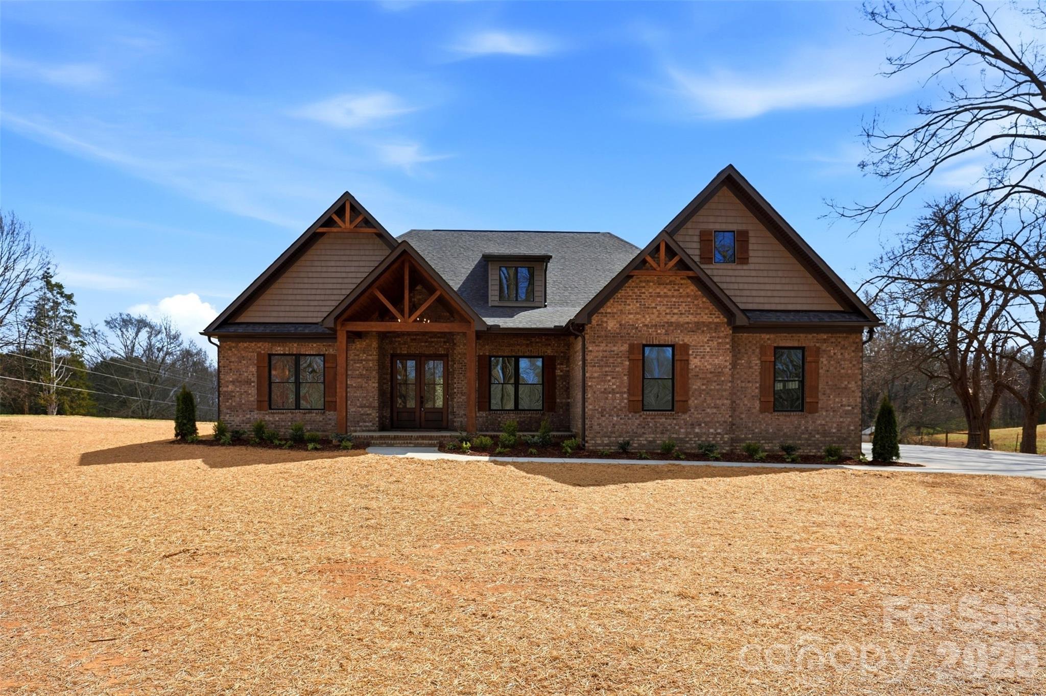 4734 Polk Ford Road Stanfield, NC 28163 - Photo 2 of 48 a front view of a house with a yard