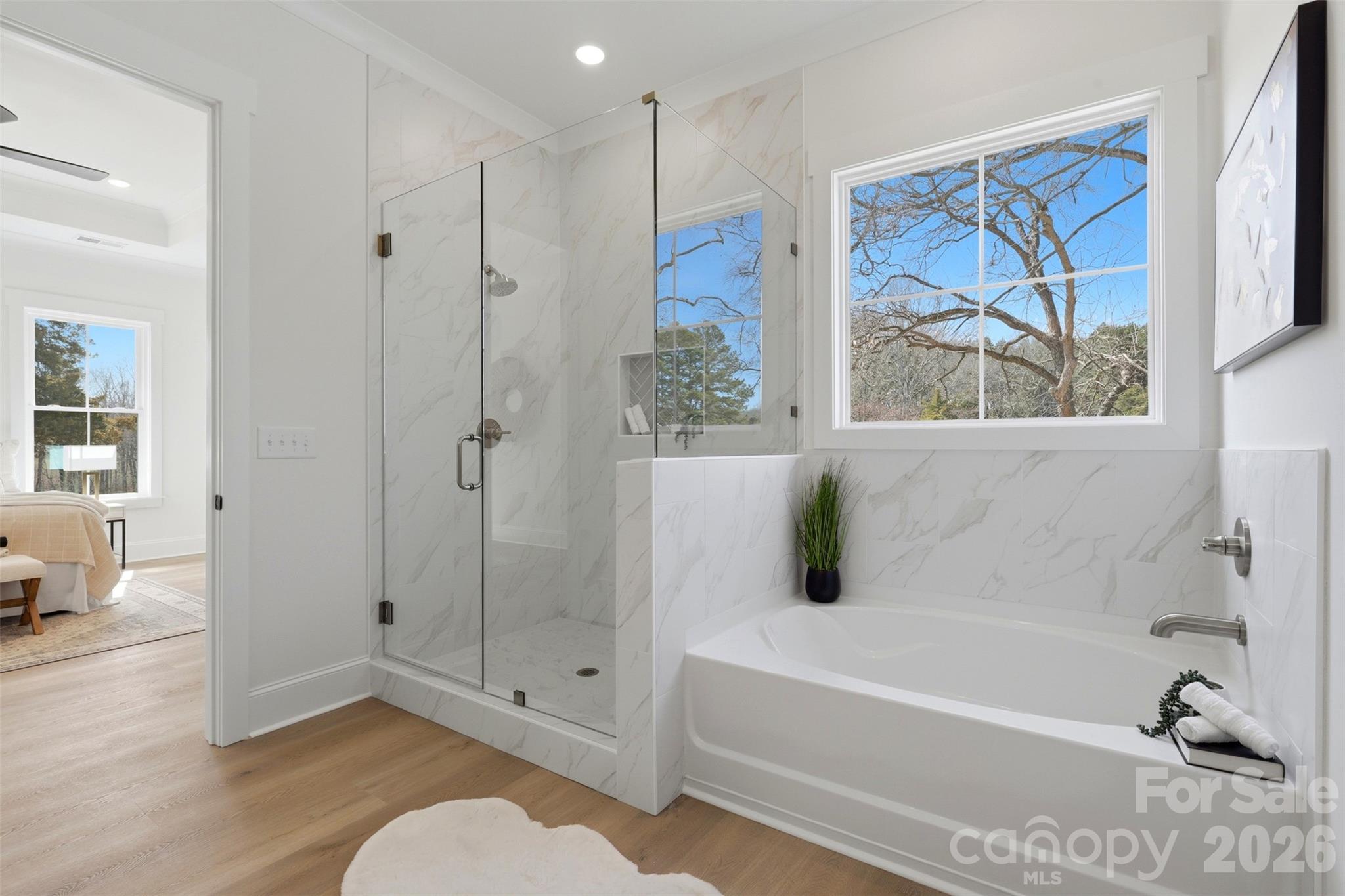 4734 Polk Ford Road Stanfield, NC 28163 - Photo 25 of 48 a bathroom with a tub and a shower